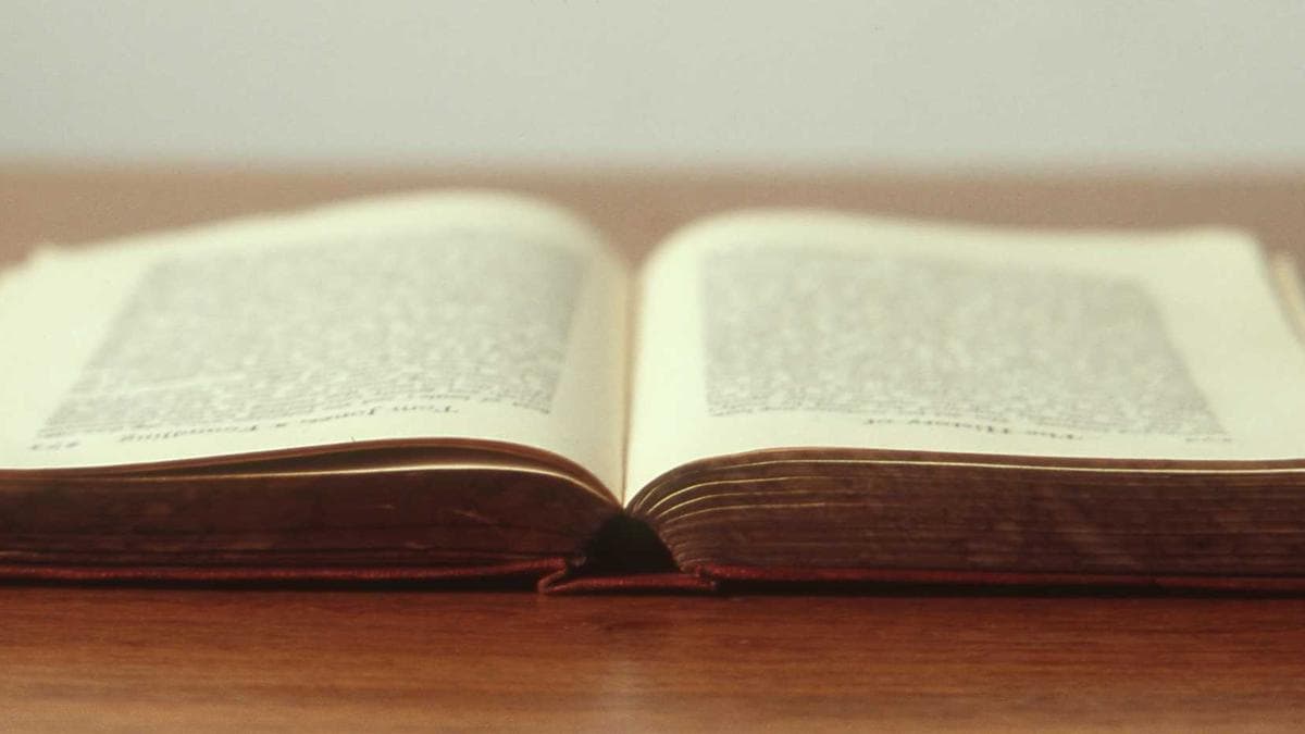 Sales team reviewing deal strategy around a table