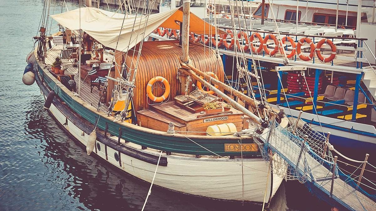 Sales professional writing LinkedIn content on a laptop in a professional setting