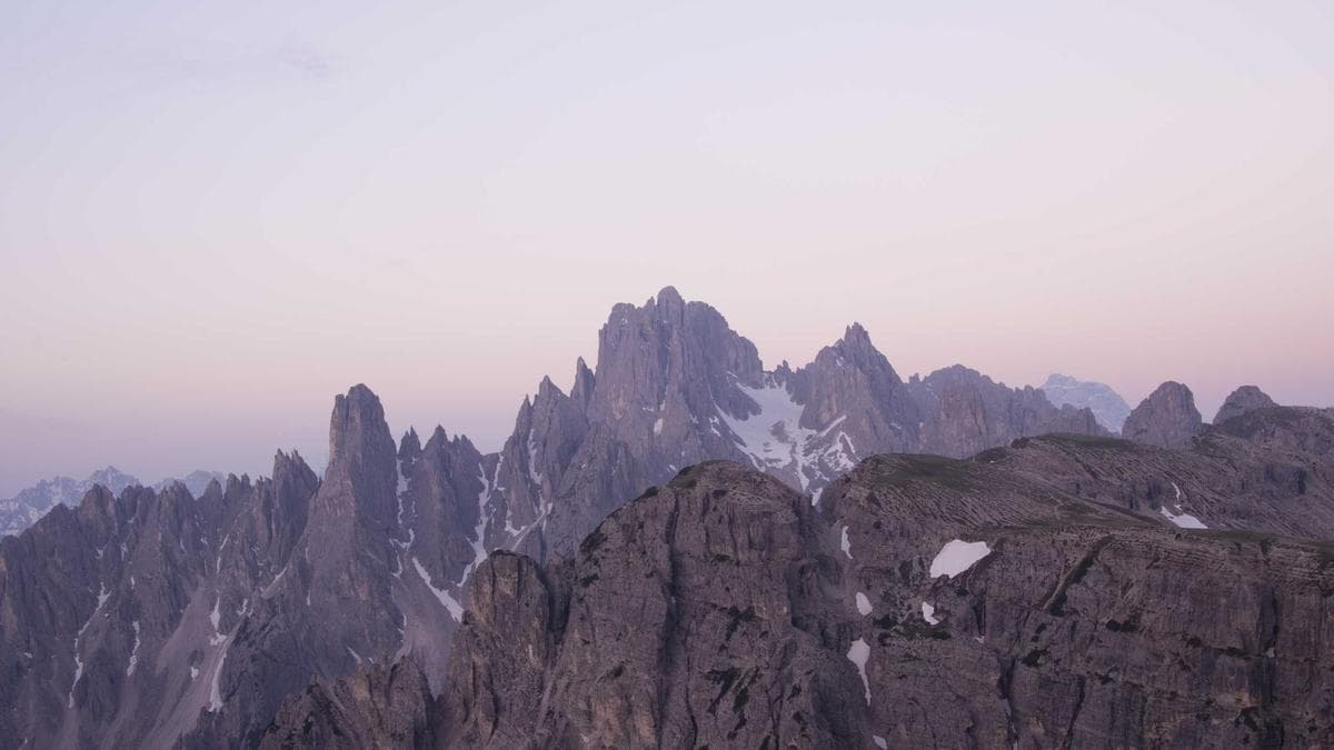 Data analyst reviewing pipeline and conversion funnel charts on a laptop at a startup office