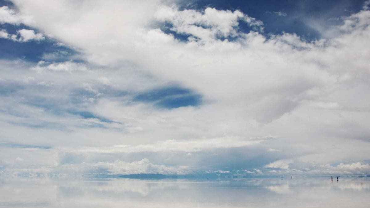 Sales team huddle with manager providing coaching support